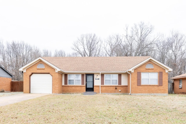 single story home featuring a garage and a front yard