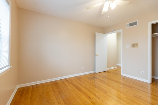 unfurnished bedroom with light hardwood / wood-style floors and ceiling fan