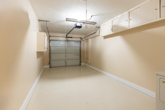 garage featuring washer / clothes dryer and a garage door opener