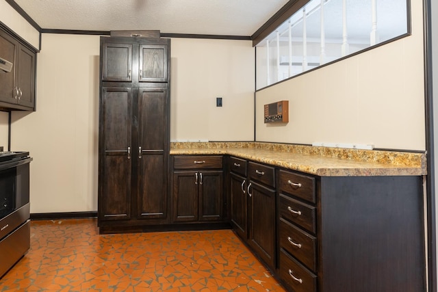 kitchen featuring stainless steel electric range oven, dark brown cabinets, a textured ceiling, and ornamental molding