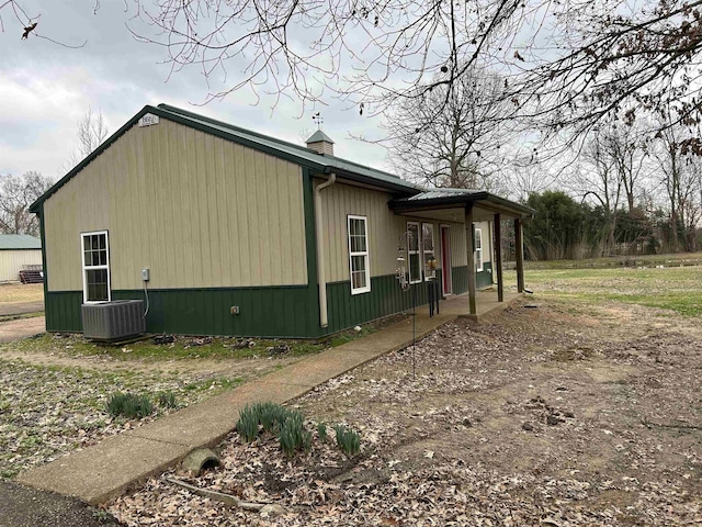 view of side of property with cooling unit