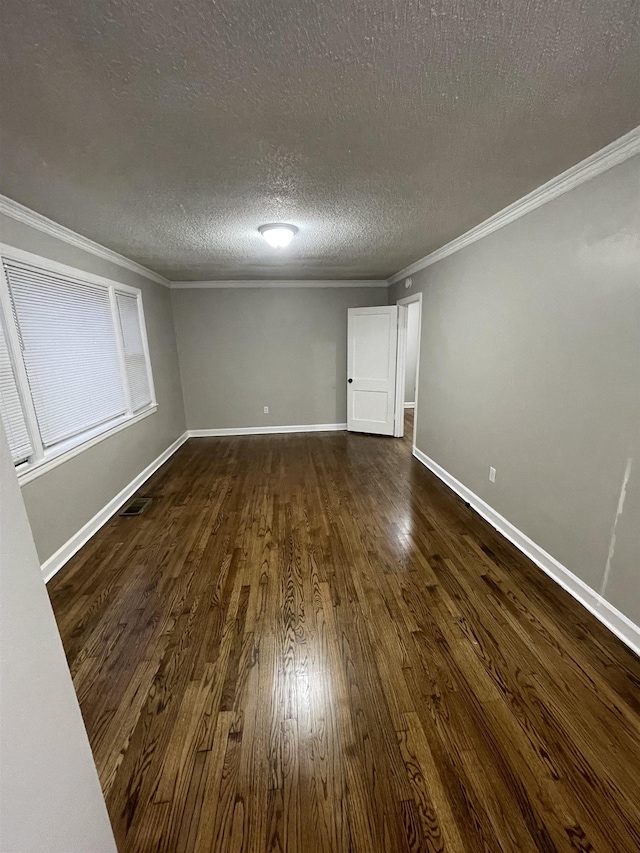 interior space with crown molding, dark hardwood / wood-style flooring, and a textured ceiling