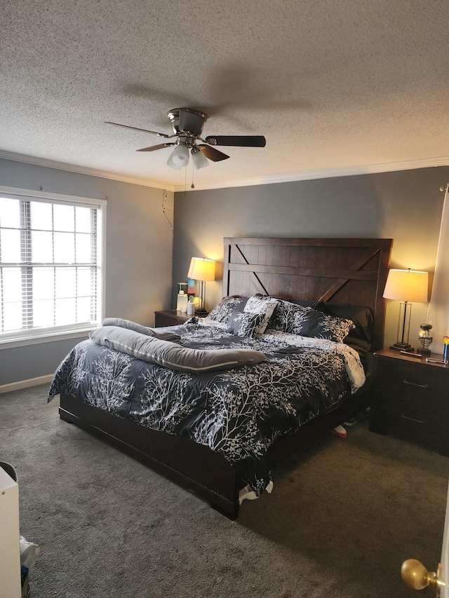 carpeted bedroom with ceiling fan and a textured ceiling