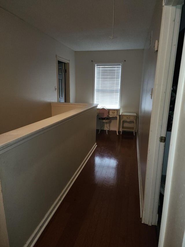 hallway featuring dark hardwood / wood-style floors