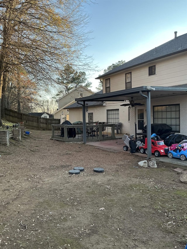 back of property with a patio and ceiling fan