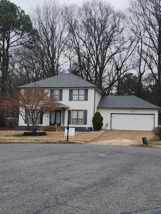 front facade with a garage