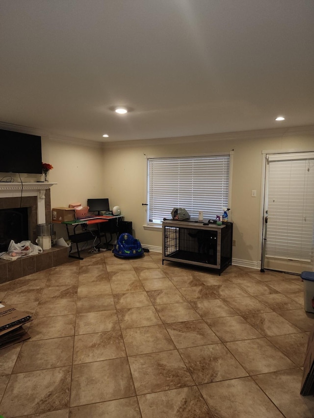 interior space with light tile patterned floors, crown molding, and a fireplace