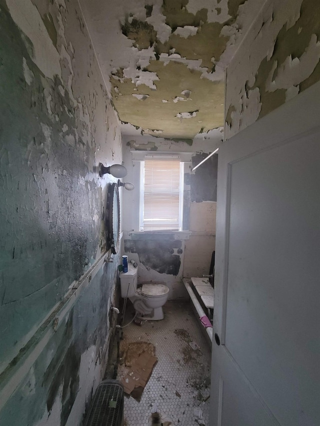 bathroom with tile patterned floors and toilet