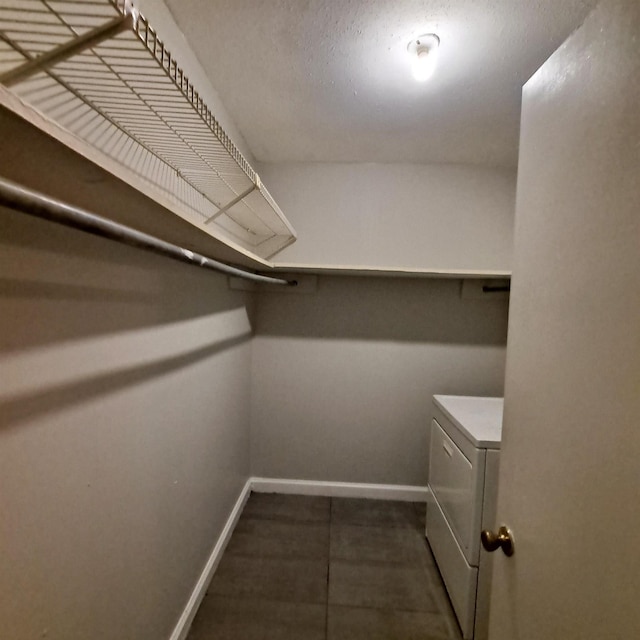 spacious closet with washer / clothes dryer