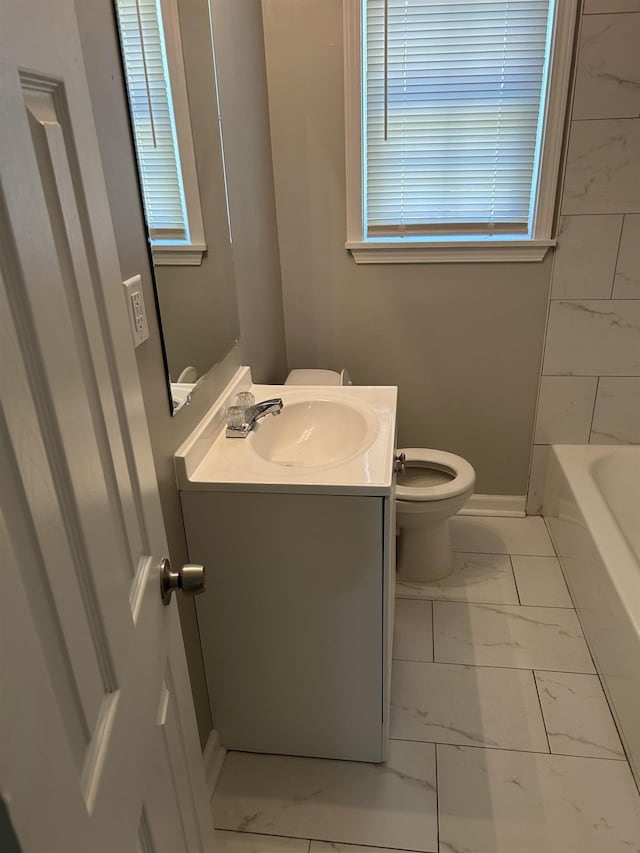 full bathroom with vanity, shower with separate bathtub, and toilet