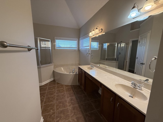 bathroom with vaulted ceiling, vanity, tile patterned floors, and plus walk in shower