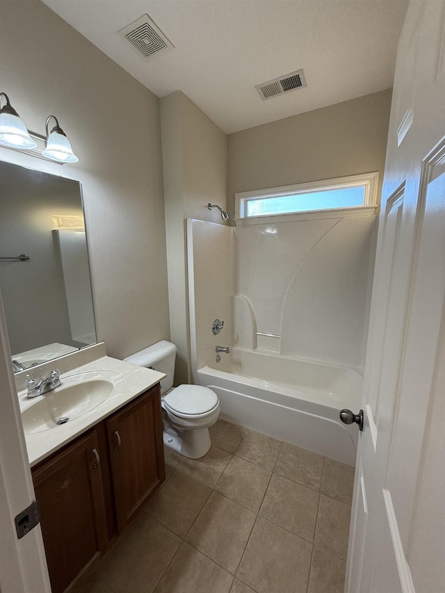 full bathroom featuring vanity, tile patterned floors, bathtub / shower combination, and toilet