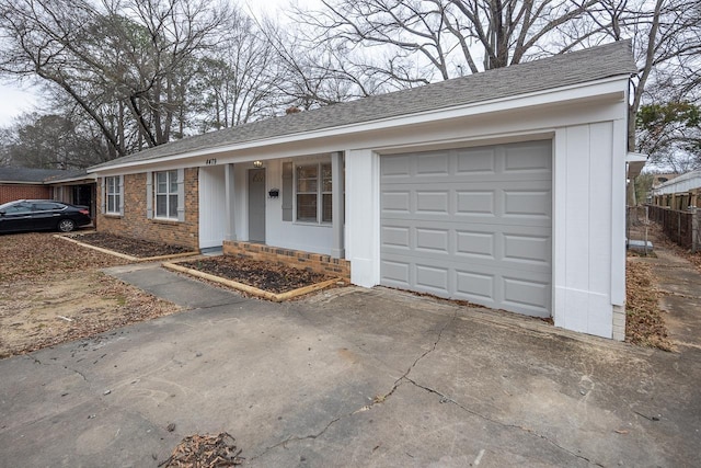 ranch-style house featuring a garage