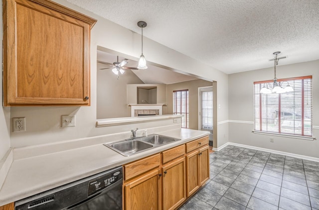 kitchen with pendant lighting, plenty of natural light, dishwasher, and sink