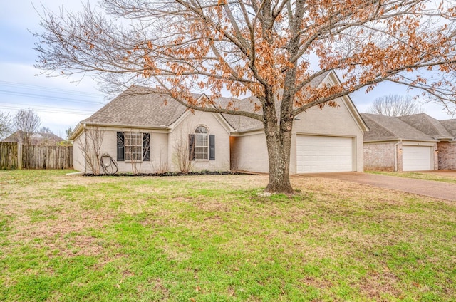 ranch-style home featuring a garage and a front lawn