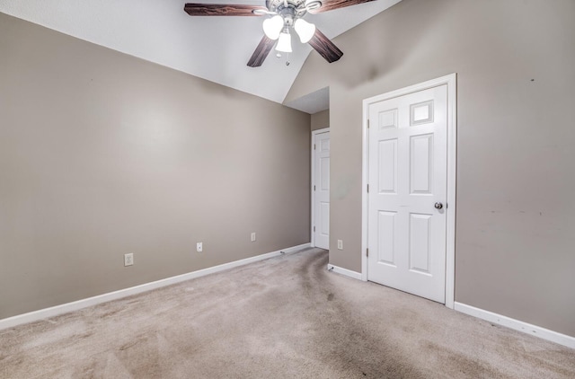 unfurnished bedroom with lofted ceiling, light carpet, and ceiling fan