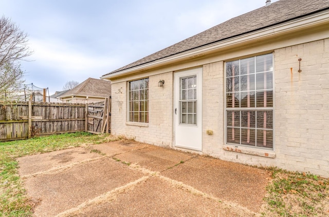 property entrance featuring a patio