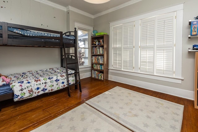 bedroom featuring dark hardwood / wood-style flooring and ornamental molding