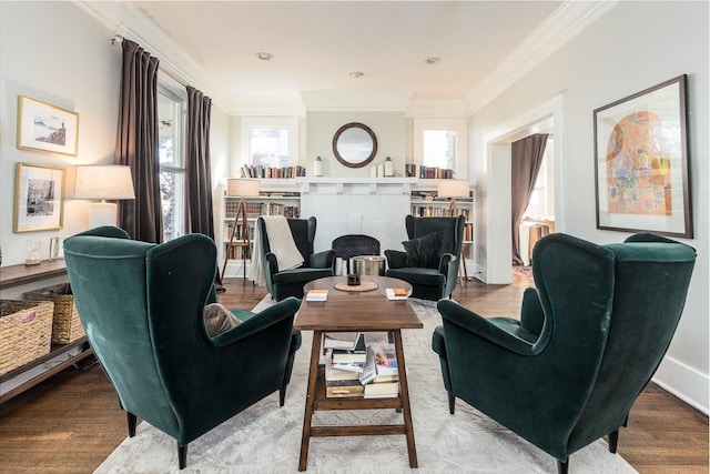 living room with hardwood / wood-style flooring and ornamental molding