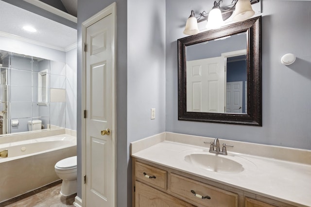 bathroom featuring vanity, crown molding, a bathtub, and toilet