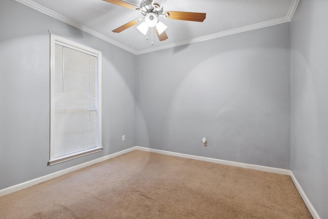 unfurnished room with carpet floors, ornamental molding, and ceiling fan