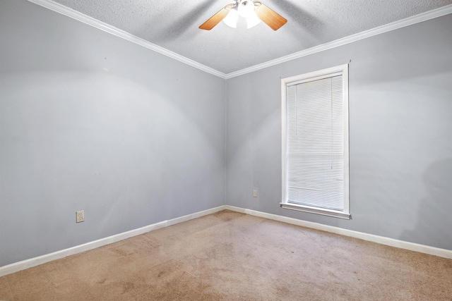 carpeted empty room with crown molding, ceiling fan, and a textured ceiling