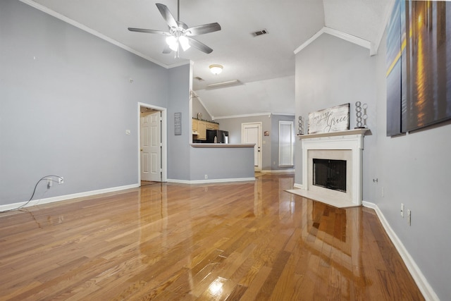 unfurnished living room featuring crown molding, high vaulted ceiling, wood-type flooring, and ceiling fan