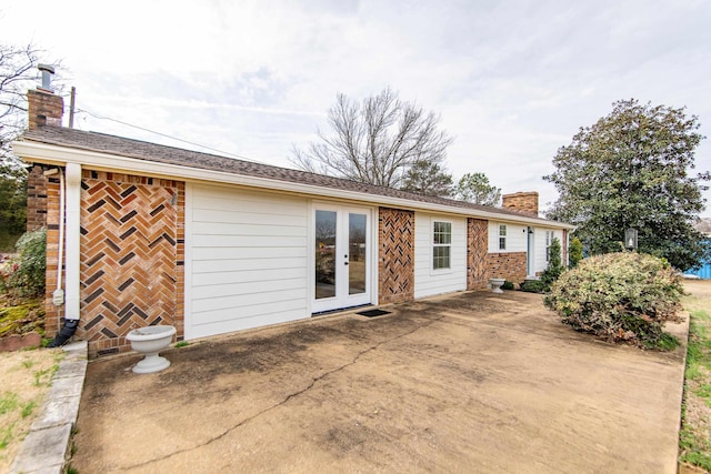 back of house featuring a patio and french doors