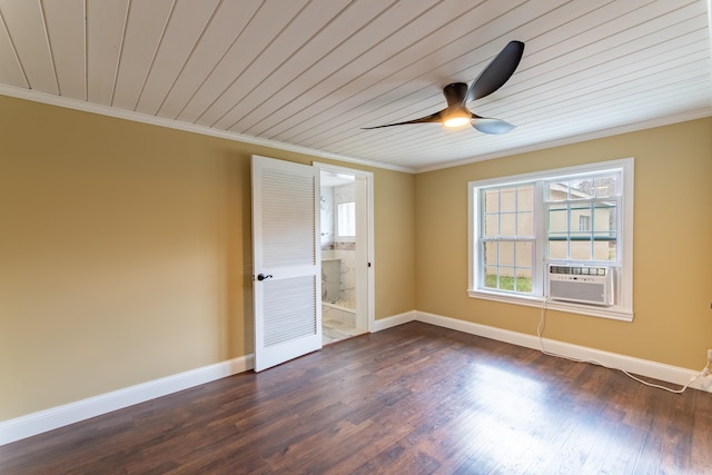 empty room with cooling unit, ornamental molding, plenty of natural light, and dark hardwood / wood-style flooring