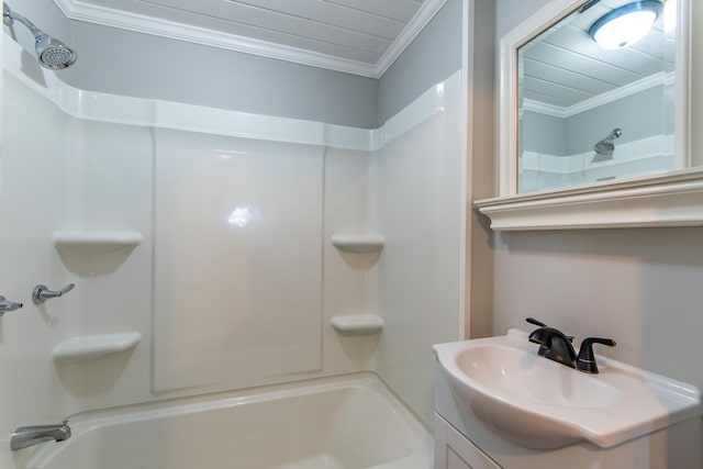 bathroom featuring crown molding, shower / washtub combination, and vanity