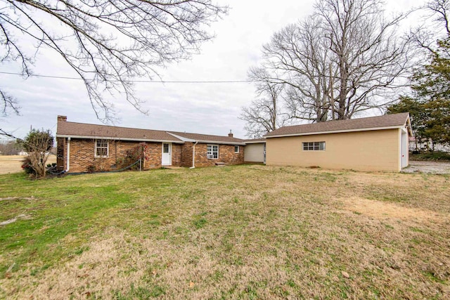 back of property featuring a lawn