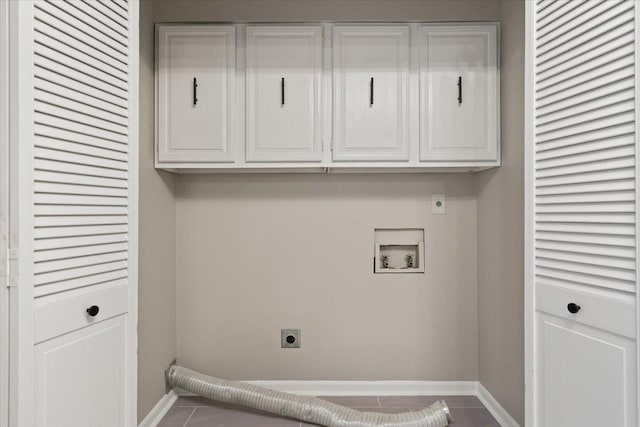 6961 Wittenham Cv, Memphis, TN 38119 - washroom with hookup for a washing machine, tile patterned flooring, hookup for an electric dryer, and cabinets