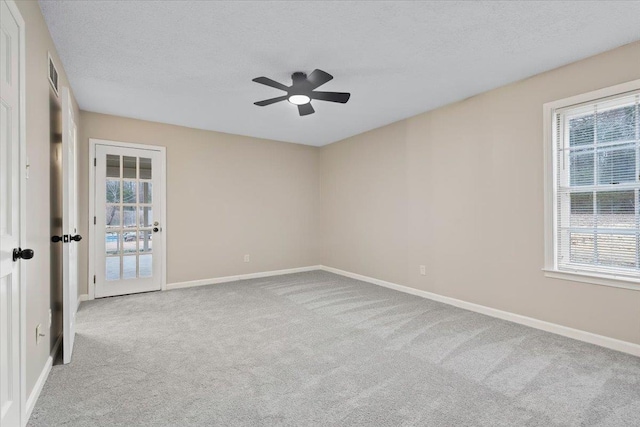 6961 Wittenham Cv, Memphis, TN 38119 - unfurnished room featuring ceiling fan, light colored carpet, and a textured ceiling