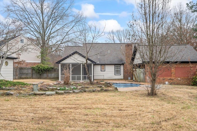 6961 Wittenham Cv, Memphis, TN 38119 - rear view of property with a sunroom, a yard, and a patio area