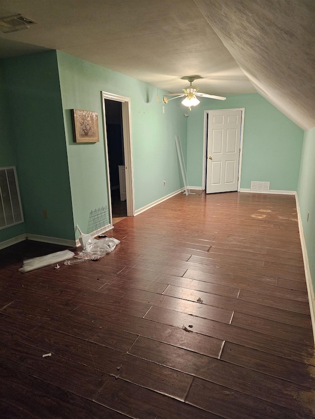 bonus room featuring hardwood / wood-style flooring, vaulted ceiling, a textured ceiling, and ceiling fan