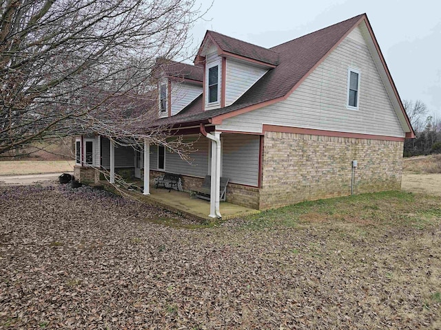 view of home's exterior with a patio area