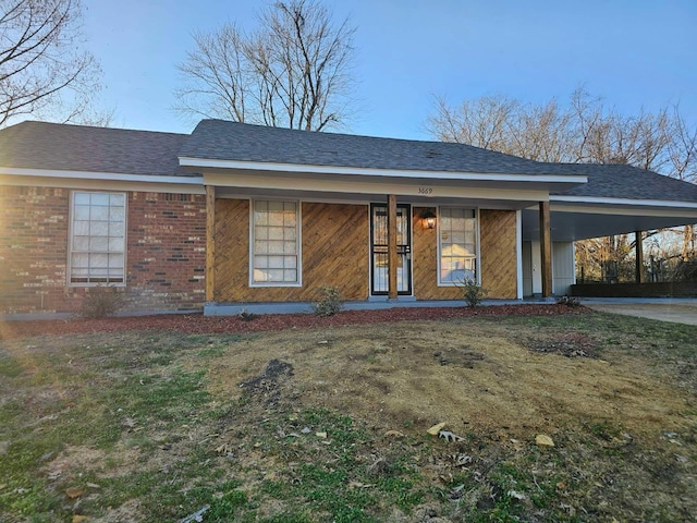 view of front facade with a carport and covered porch