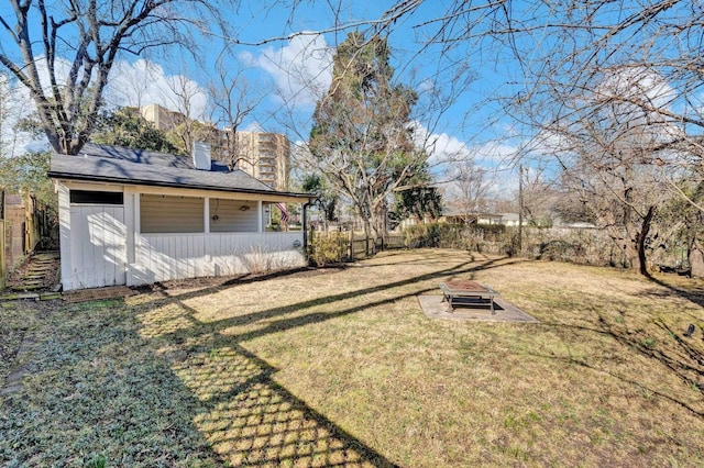 view of yard with an outdoor fire pit