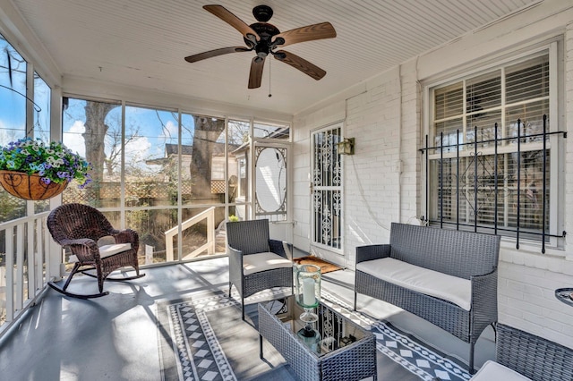 sunroom / solarium with ceiling fan