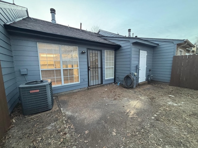 back of property with central AC unit