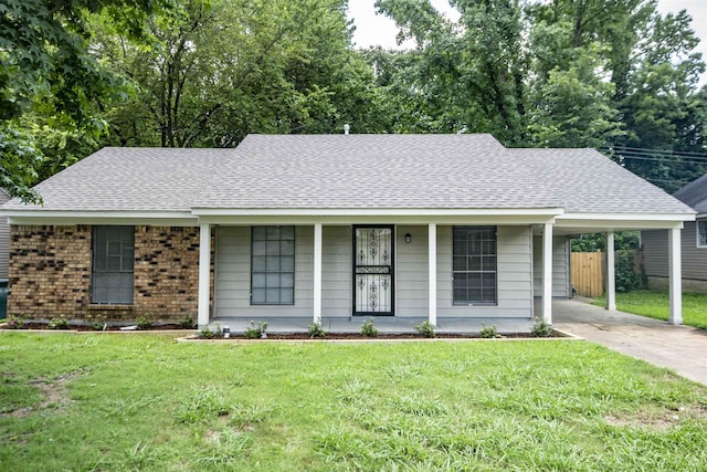 ranch-style home with a front yard, a carport, and covered porch