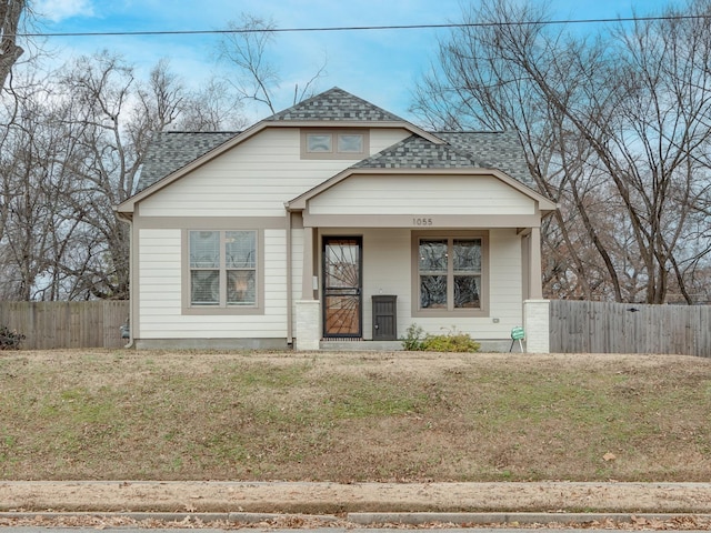 view of front facade with covered porch and a front lawn