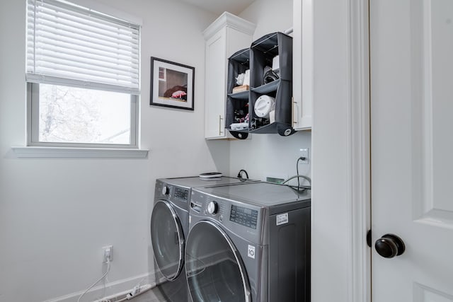 laundry area with cabinets and washer and dryer