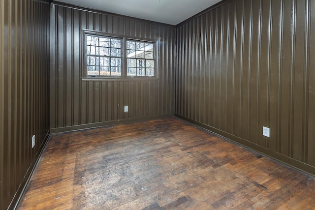 spare room featuring dark hardwood / wood-style floors