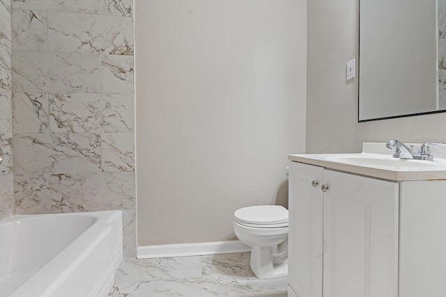 full bathroom featuring vanity, tiled shower / bath, and toilet