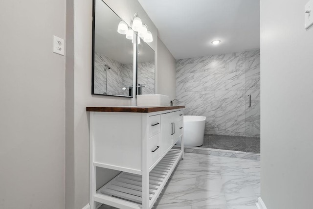 bathroom with vanity and shower with separate bathtub