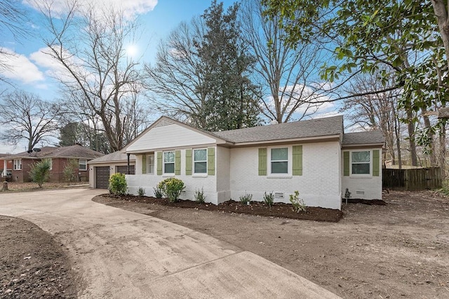 ranch-style home with a garage