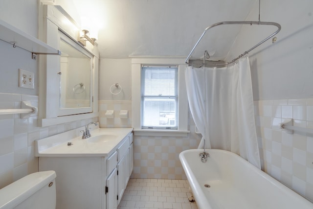 full bathroom with tile walls, tile patterned flooring, vanity, toilet, and shower / bath combo