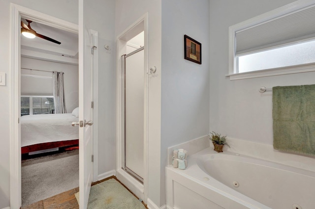 bathroom with shower with separate bathtub