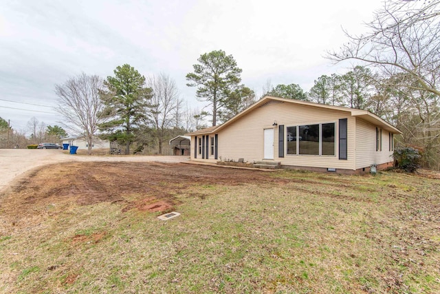 exterior space with a yard and a carport